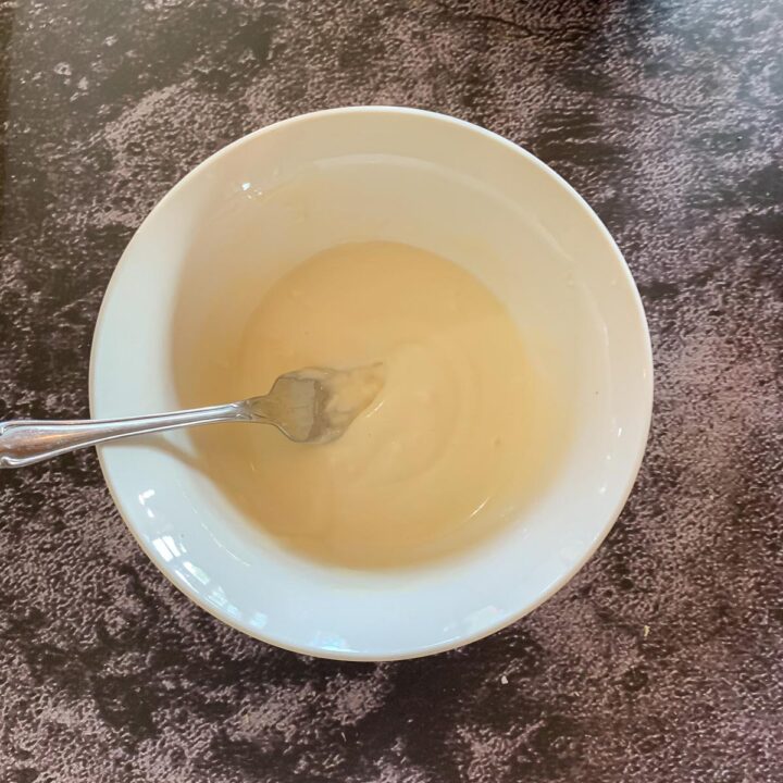 thinned out frosting in a bowl