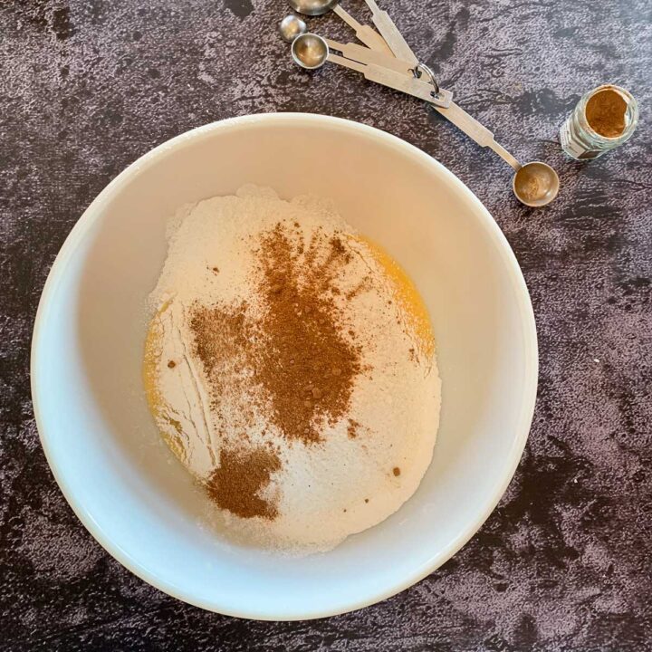 spices added to flour in a bowl