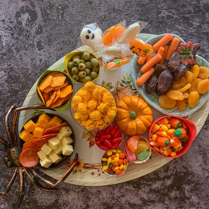 candy and fruit on a halloween board