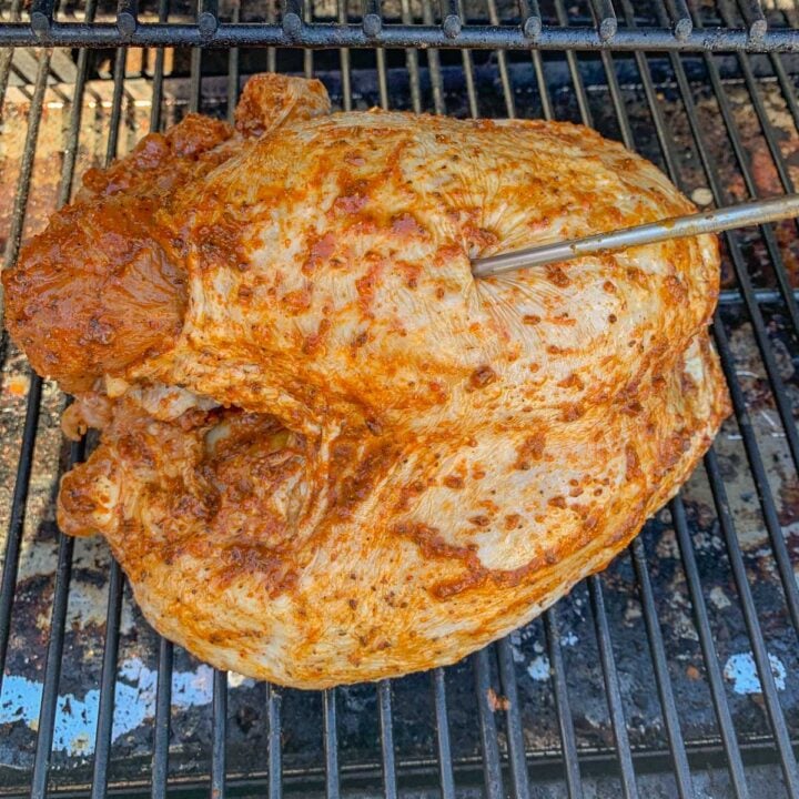 uncooked turkey breast on the grill