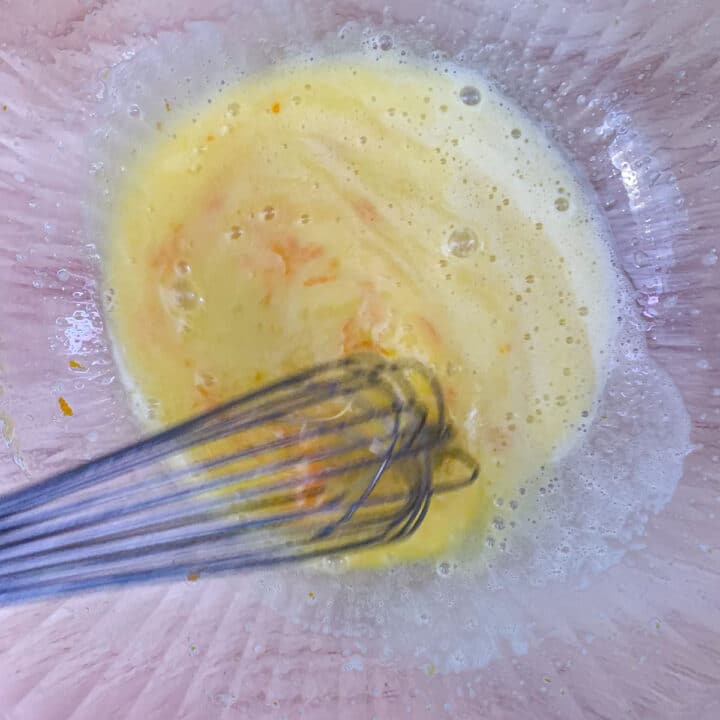 eggs being whisked in a bowl