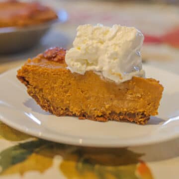 a slice of no-bake pumpkin pie with whipped cream
