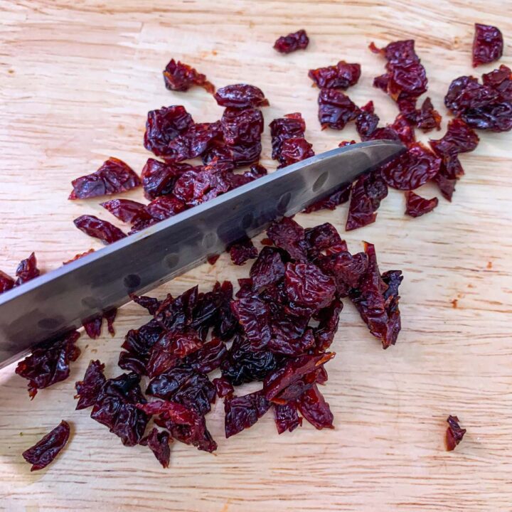 dried cherries being chopped