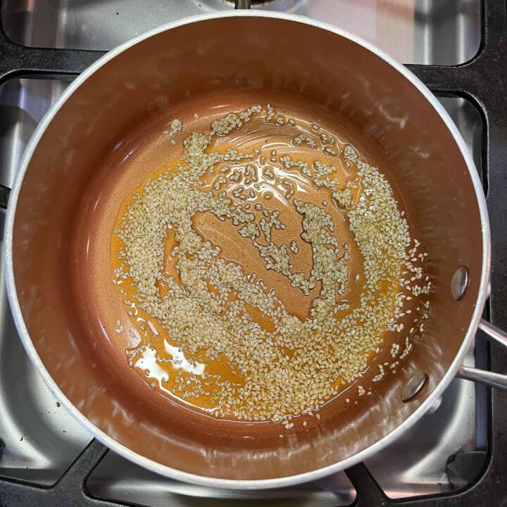 oil and sesame seeds in a pot