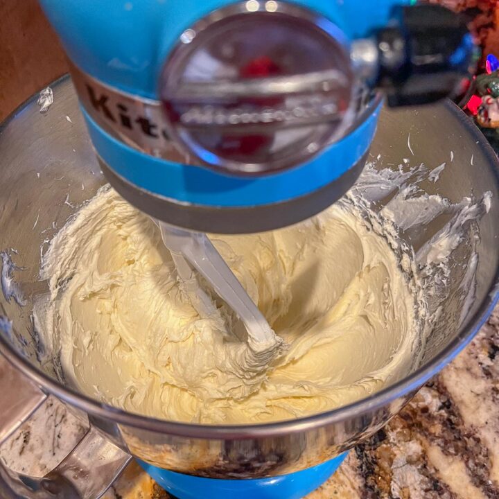 cheesecake being mixed in a mixing bowl