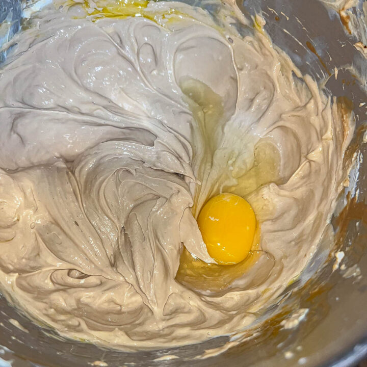 coffee cheesecake batter with an egg
