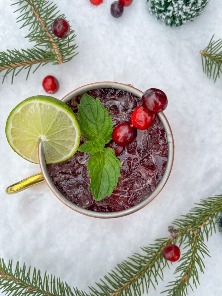 cranberry Moscow Mule with a snowy background