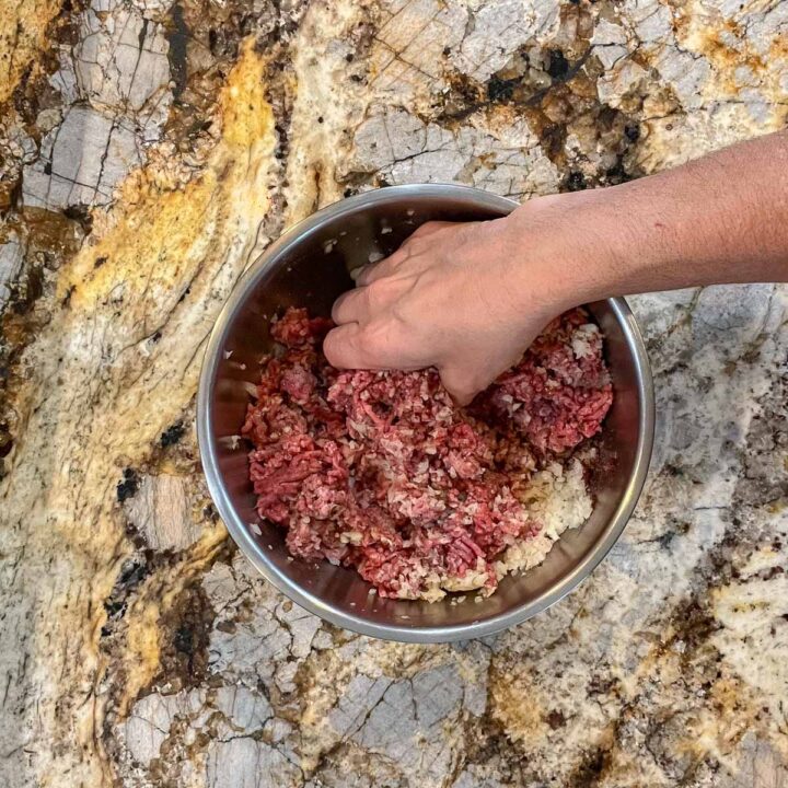 kneading meat in a bowl