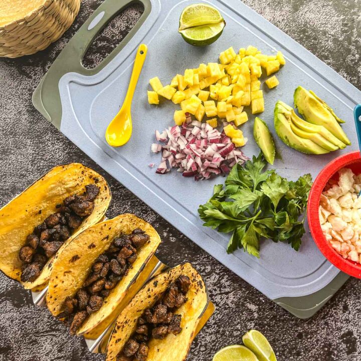 pork de adobada tacos with diced pineapple, onion, parsley, and avocados