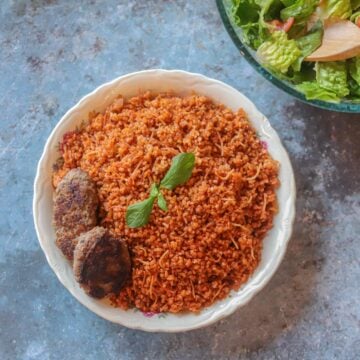 bulgur pilaf in a plate with kotletai
