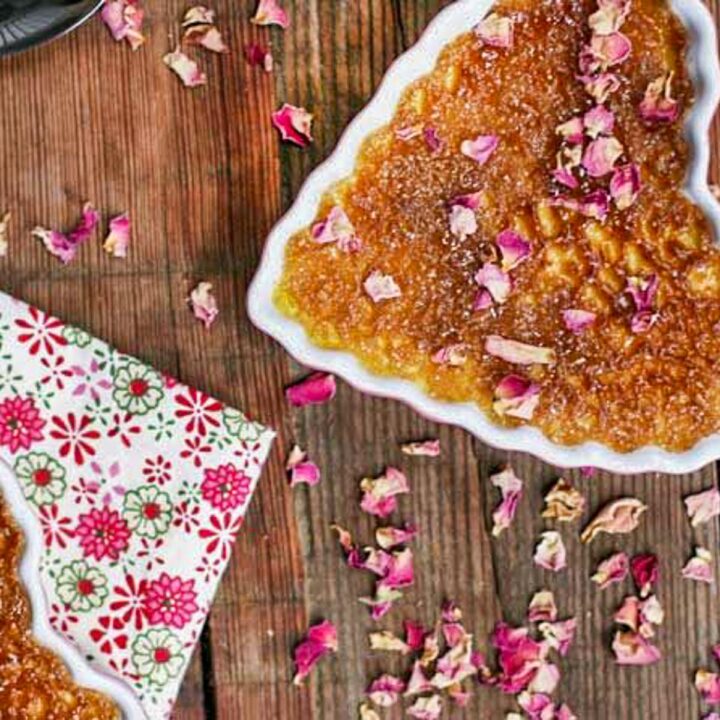 creme braless with rose petals over it