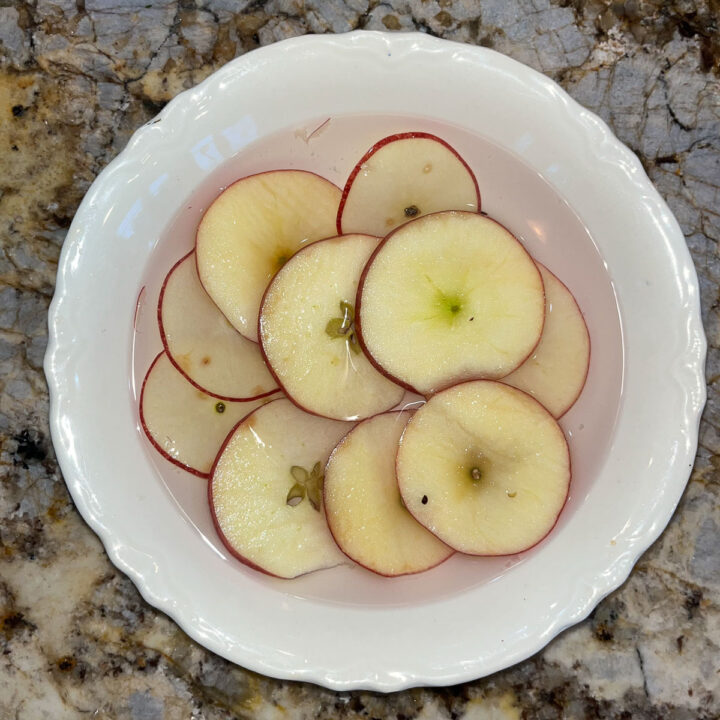 apple slices soaking in water