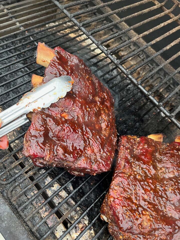 traeger smoked beef ribs brushed with bbq sauce 