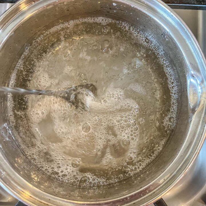 syrup being stirred in a pan