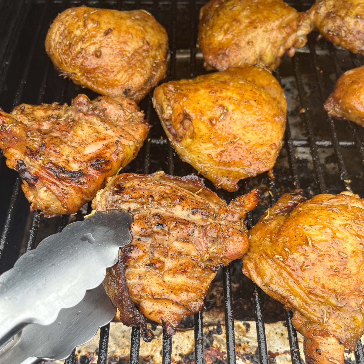 flipping chicken on the grill