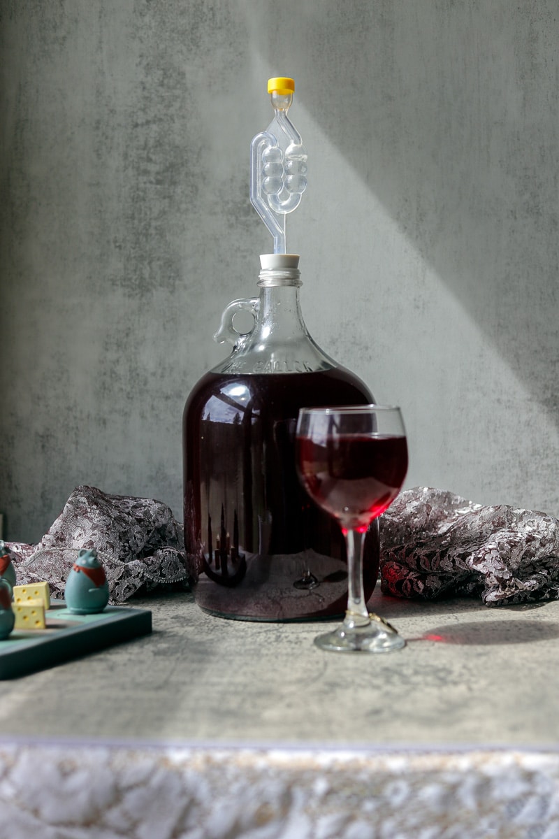 chokecherry wine and a jar and more in a glass