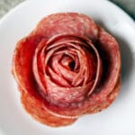 salami rose on a white plate