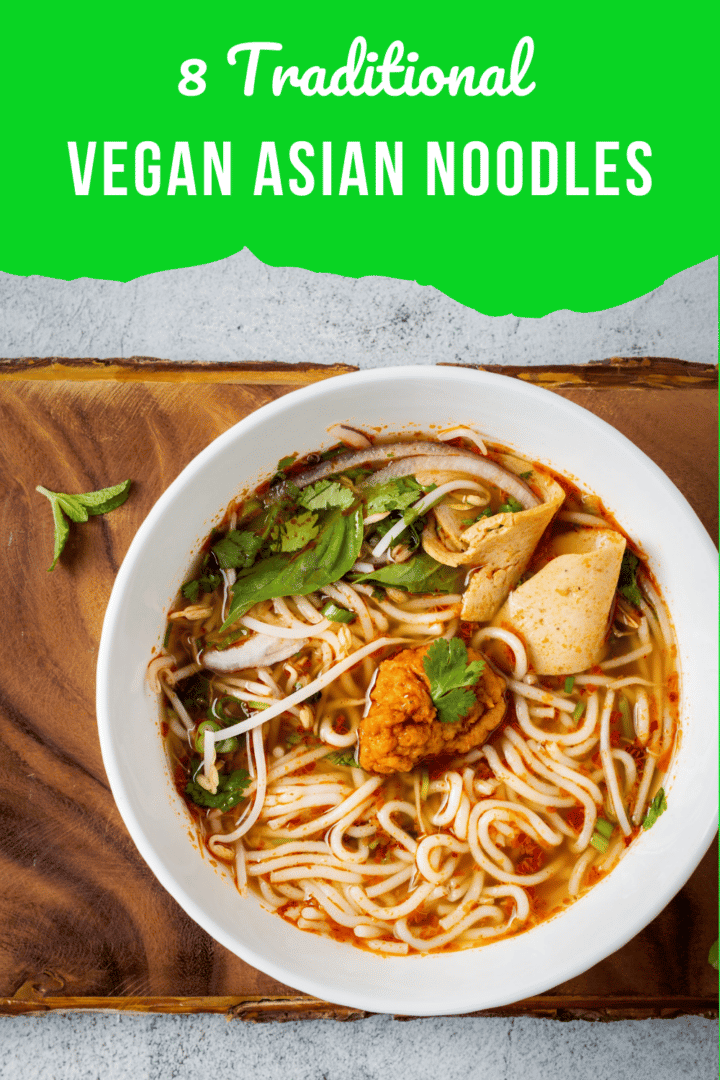 noodles in a white bowl over a wooden plank