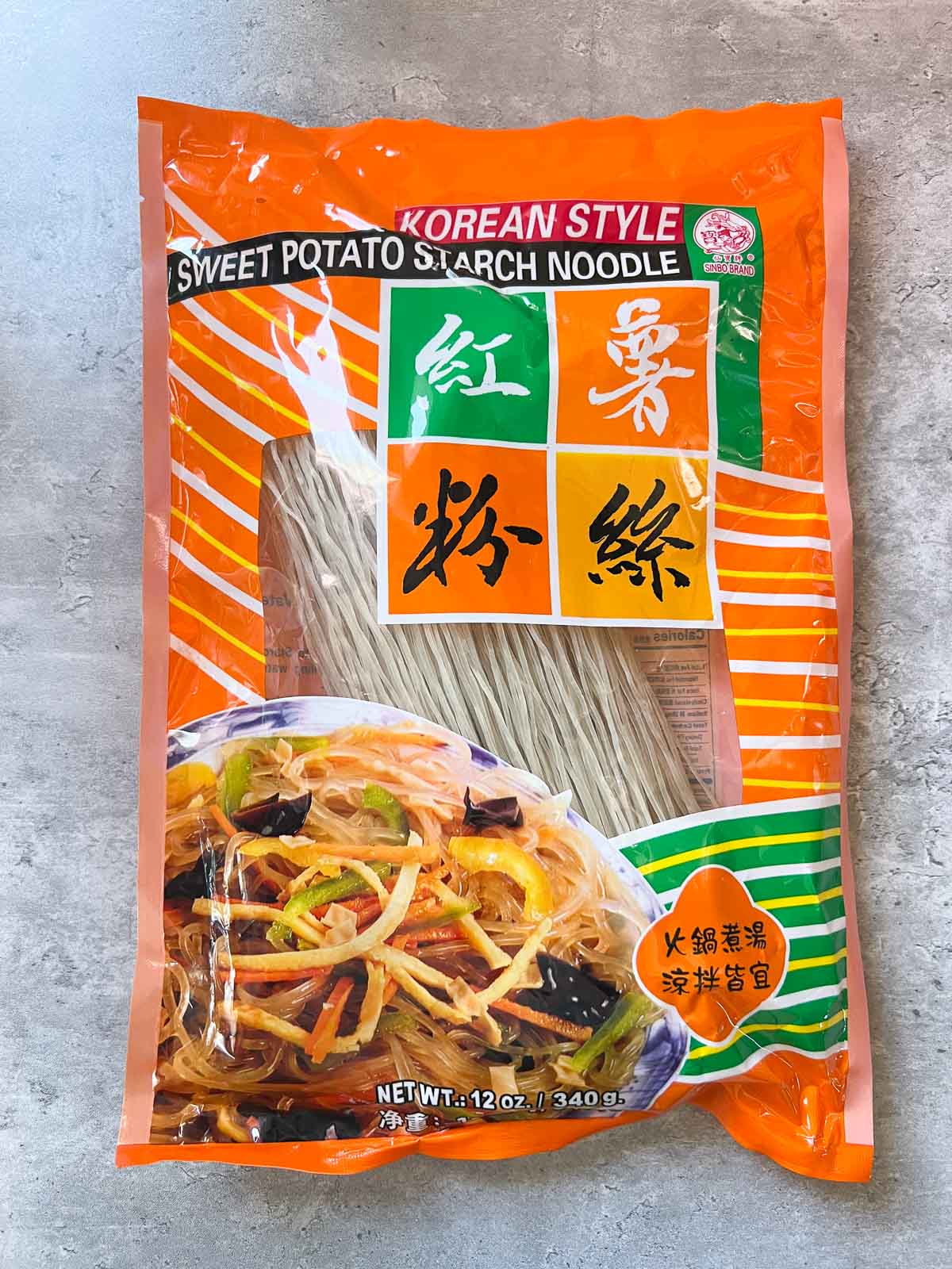 pack of dried vegan dangmyeon noodles on a granite countertop
