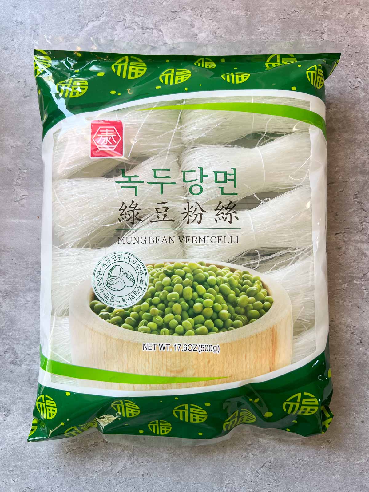 pack of dried vegan cellophane noodles on a granite countertop