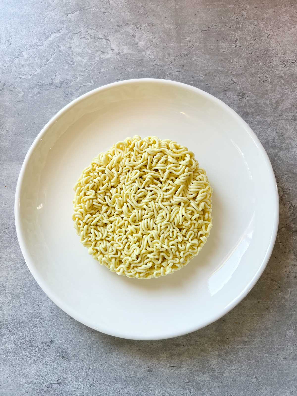 dry ramen on a white plate
