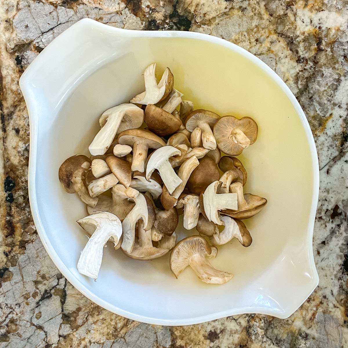 bowl with sliced mushrooms