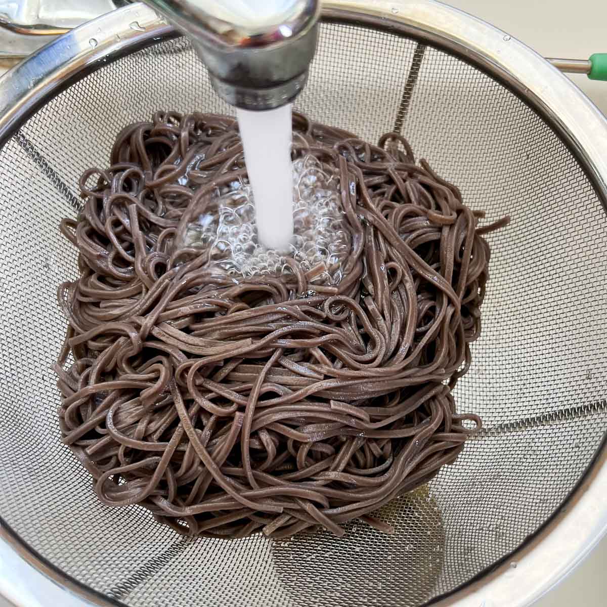 cold water running over the Japanese soba noodles