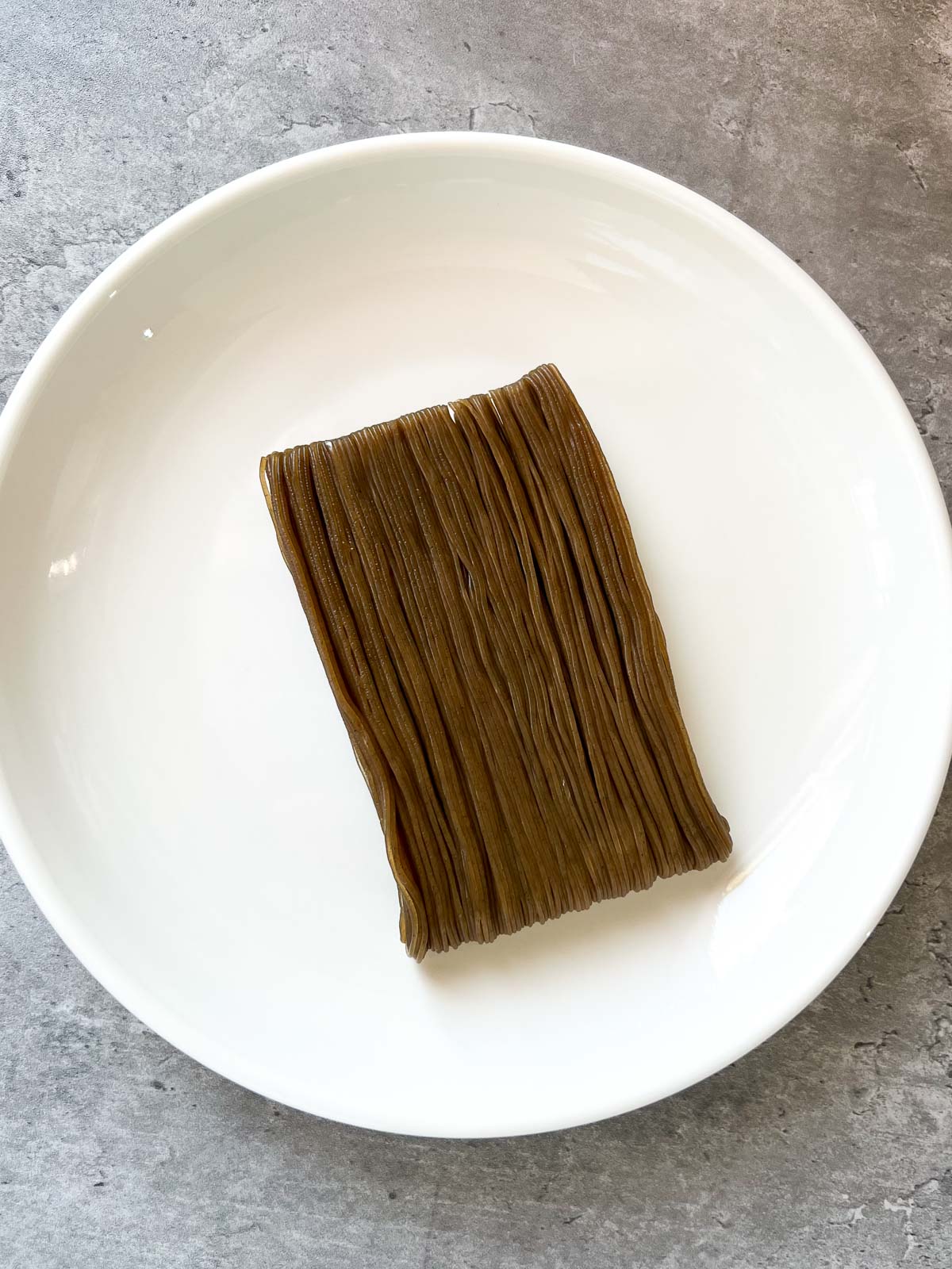 Naengmyeon on a white plate
