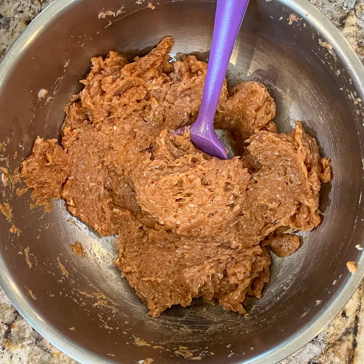chicken paste in a bowl as a result of being processed