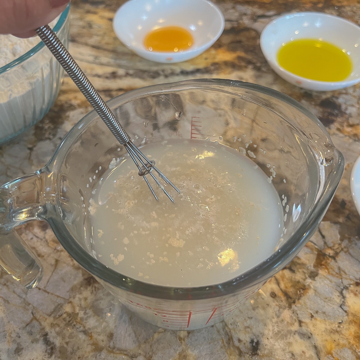 whisking yeast into water