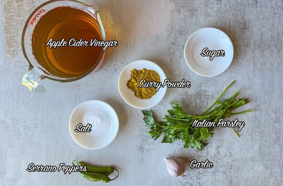 turshi recipe ingredients including vinegar, spices, garlic, and parsley.