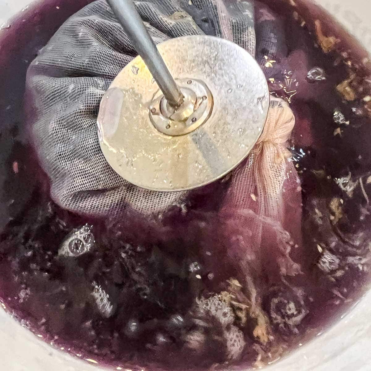 mashing berries for fruit wine