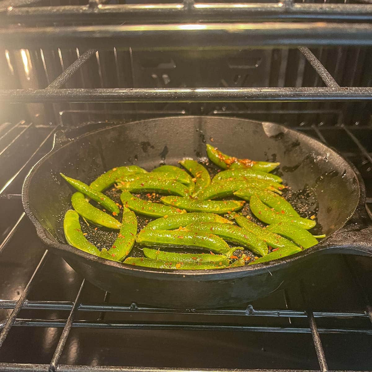 snap peas in a cast iron pan in the oven