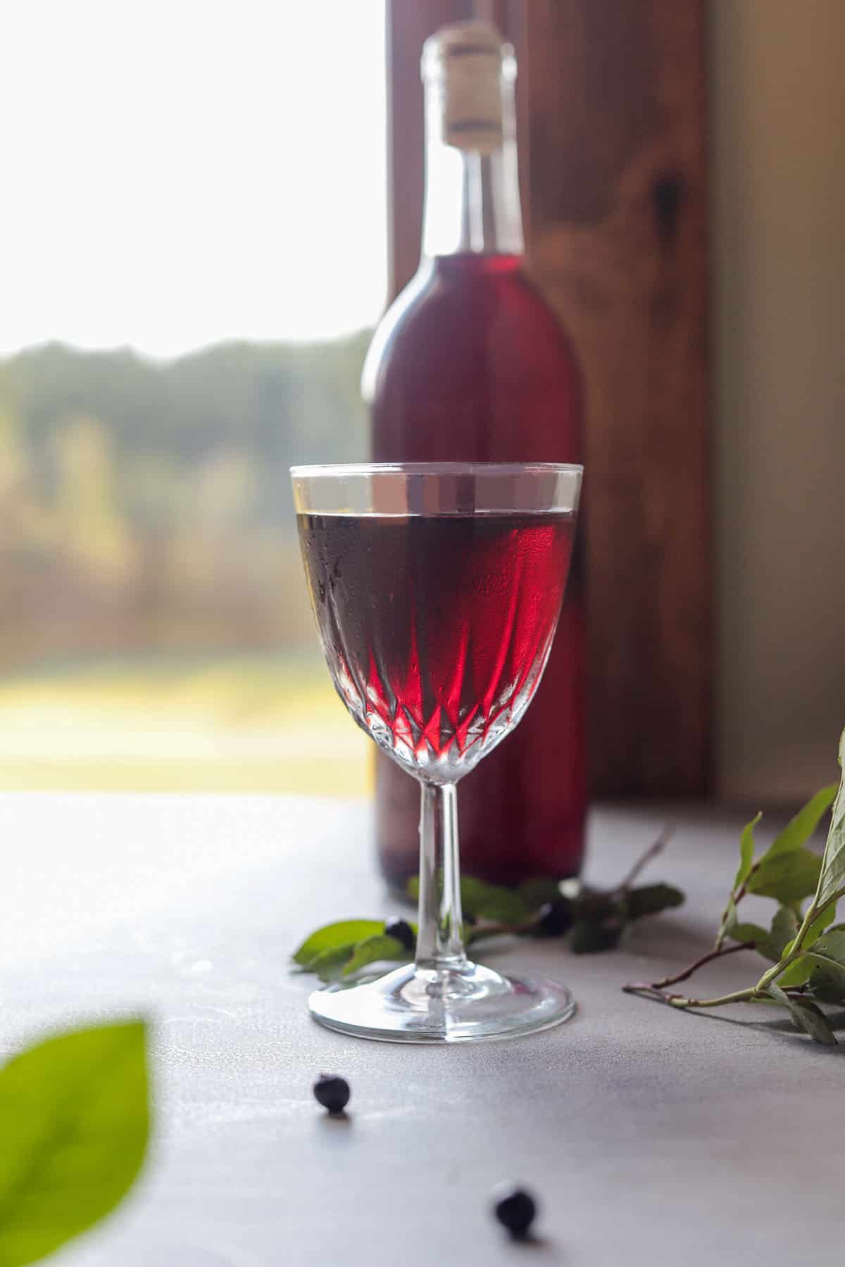 huckleberry wine in a windowsill