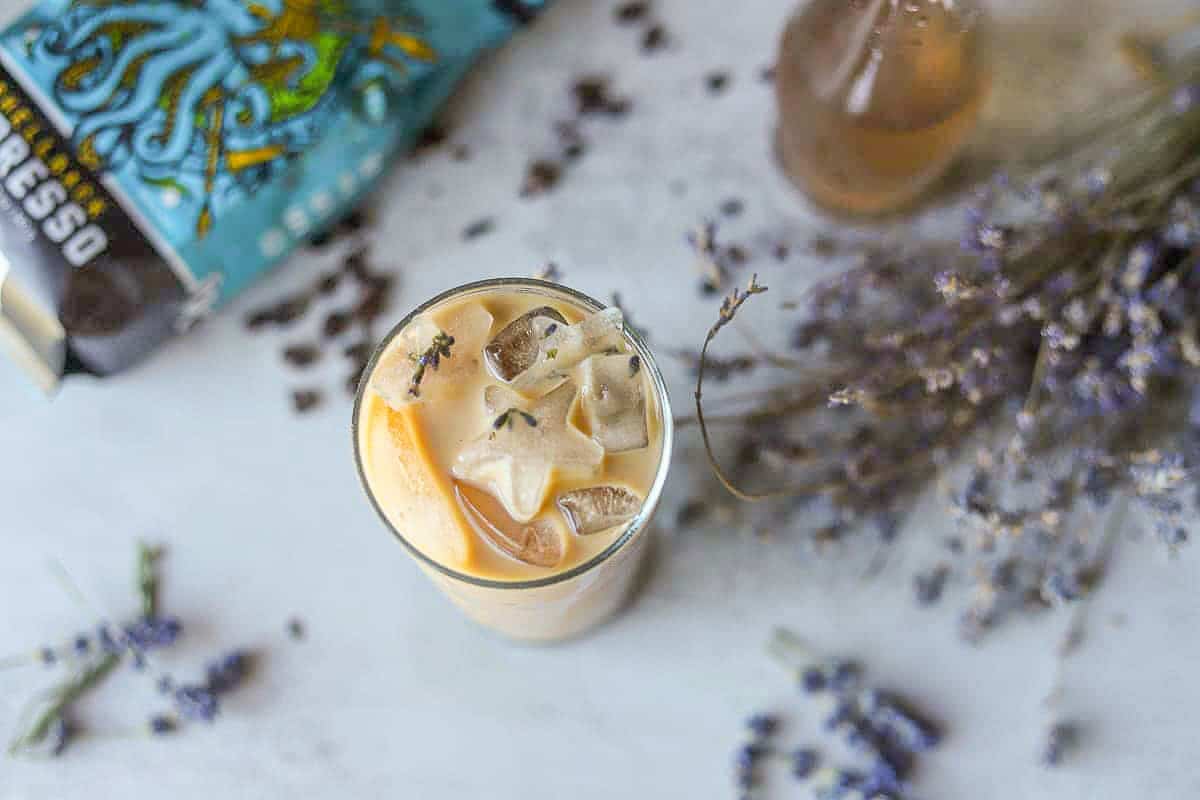 lavender latte with lavender around it.