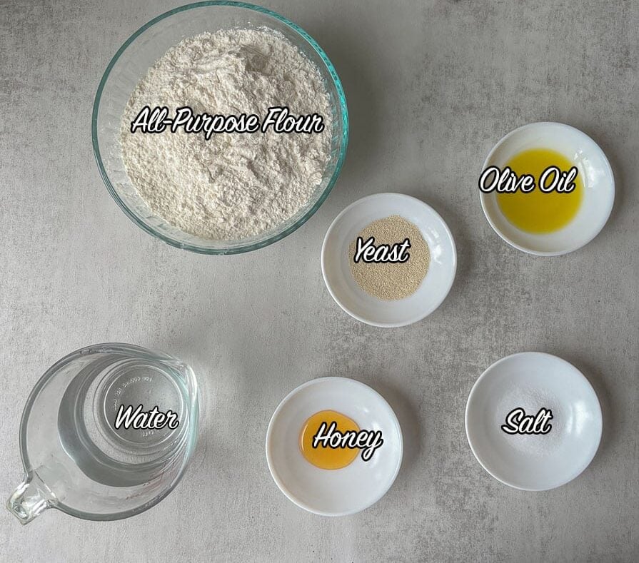 Middle Eastern bread ingredients including flour, yeast, water, and oil.