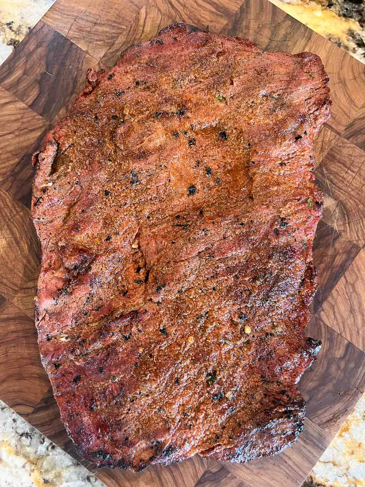 smoked carne asada on cutting board