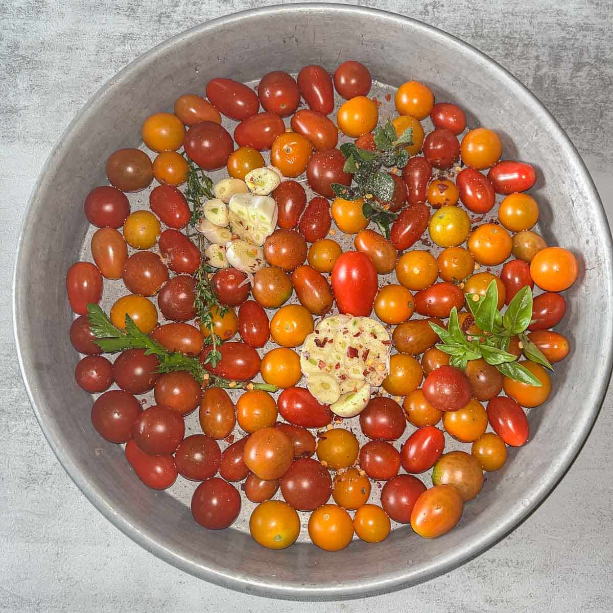a round pan with tomato confit ingredients