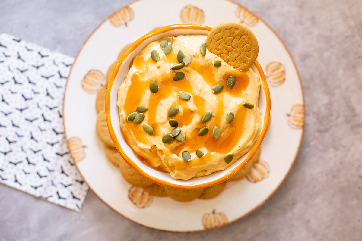 pumpkin cream cheese dip with pepitas and ginger snaps