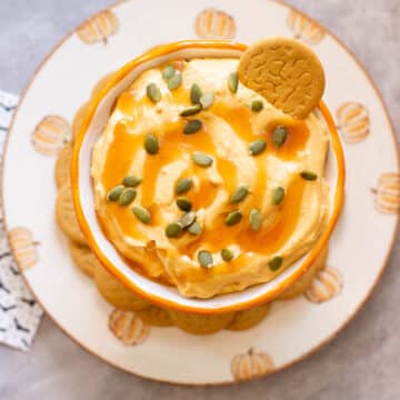 pumpkin cream cheese dip with pepitas and ginger snaps
