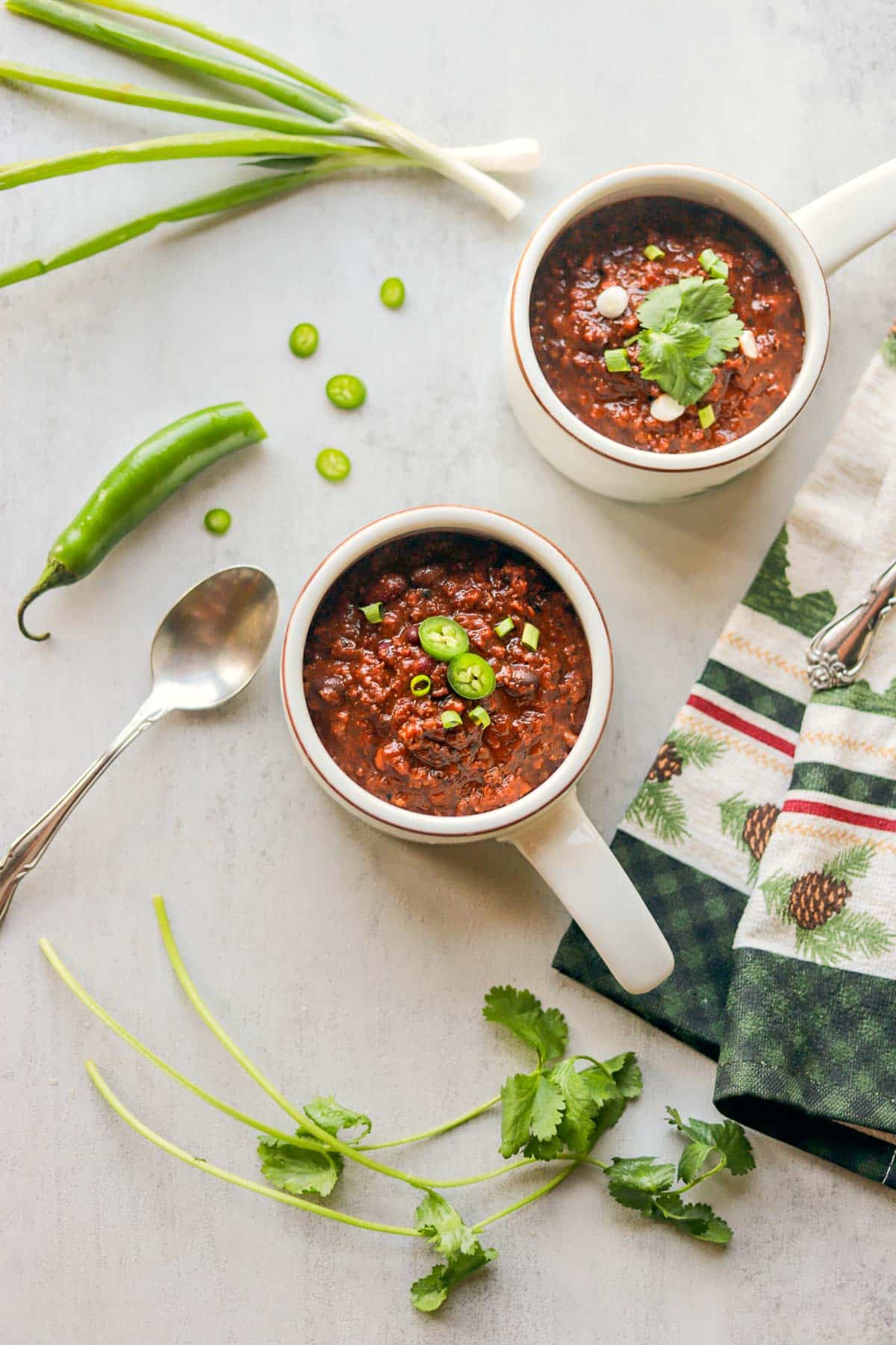 elk chili served in chili bowls with fixings