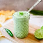 close up of cilantro lime sauce in a jar