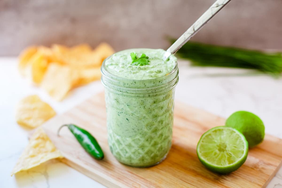 close up of cilantro lime sauce in a jar