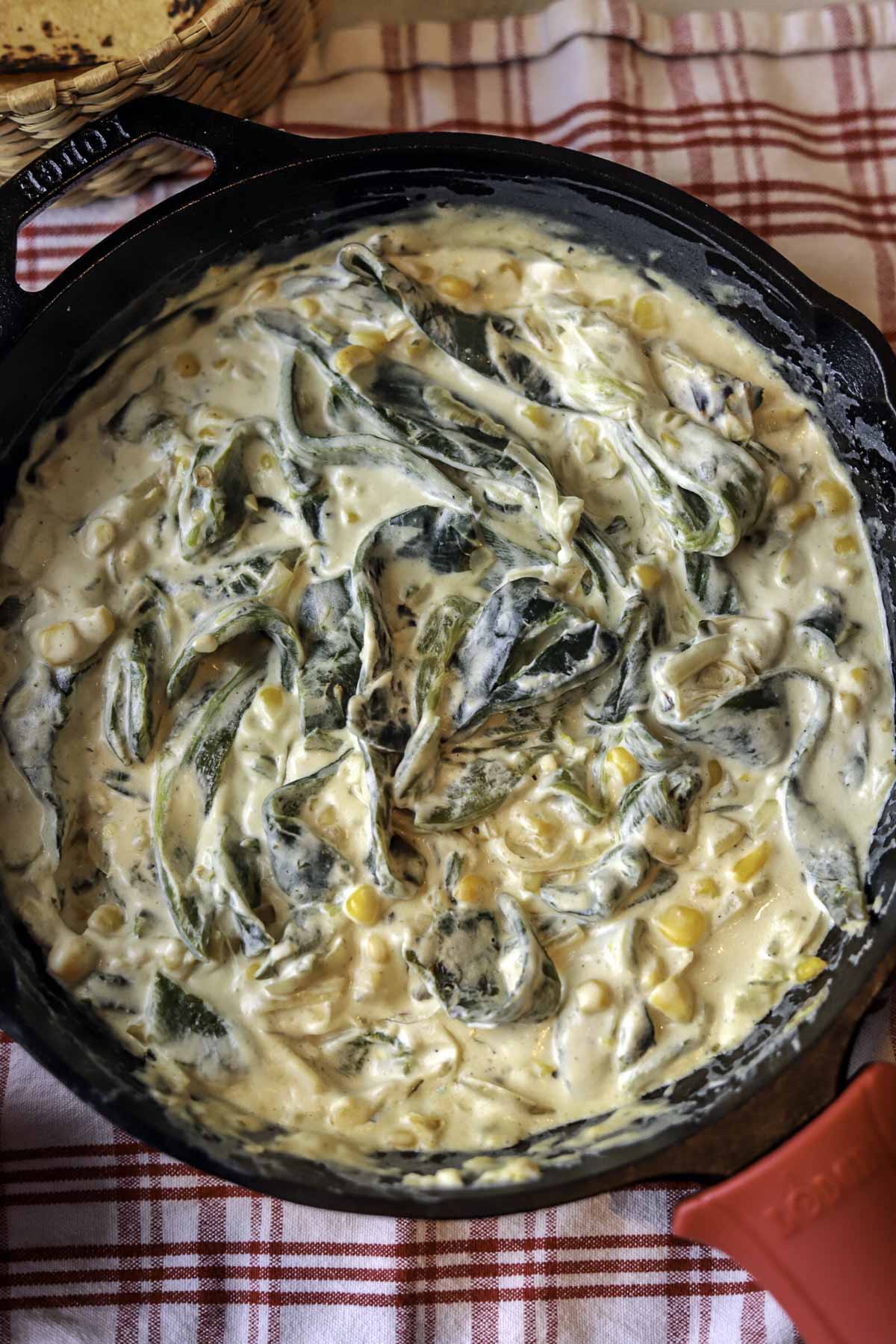 Rajas con Crema on a red and white checkered towel