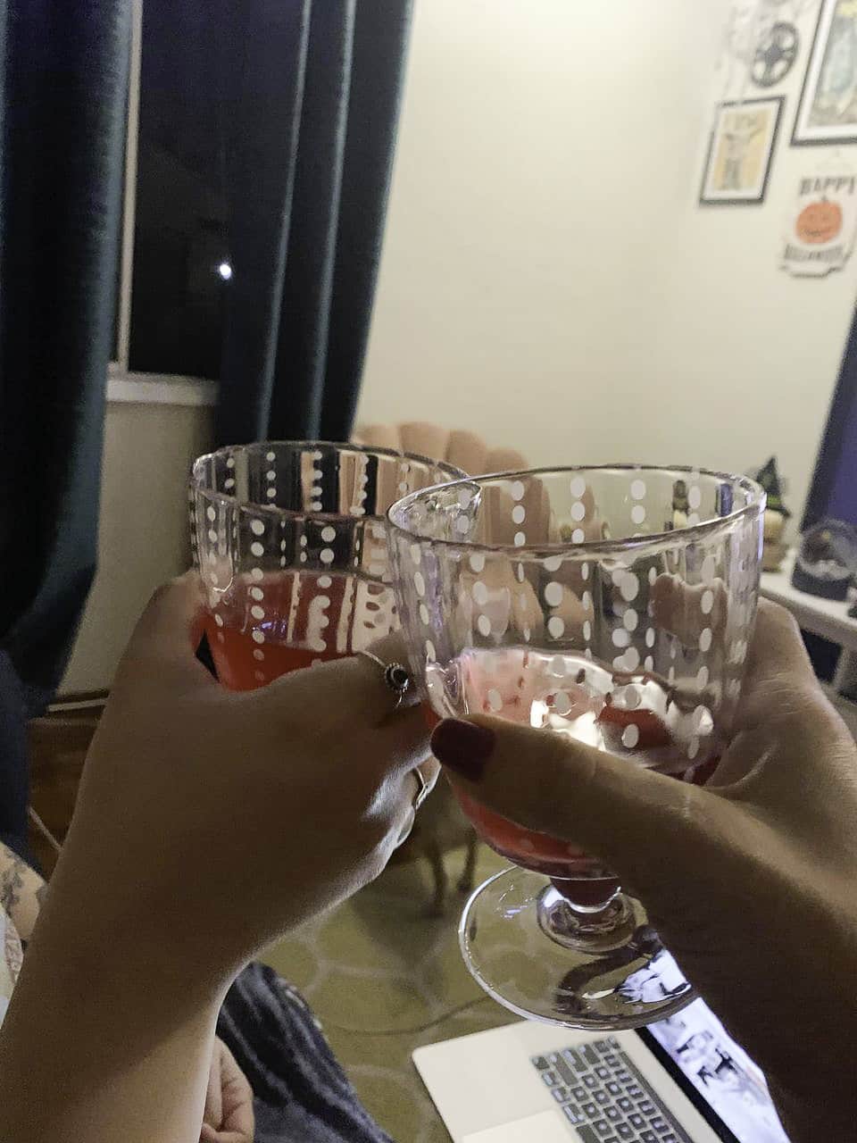 toasting with 2 glasses of wine