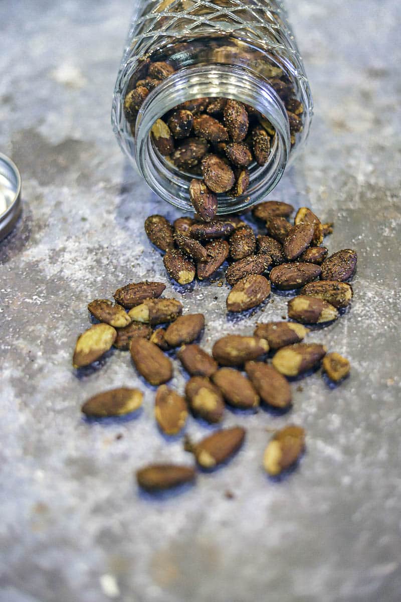 roasted almonds spilling out of a jar