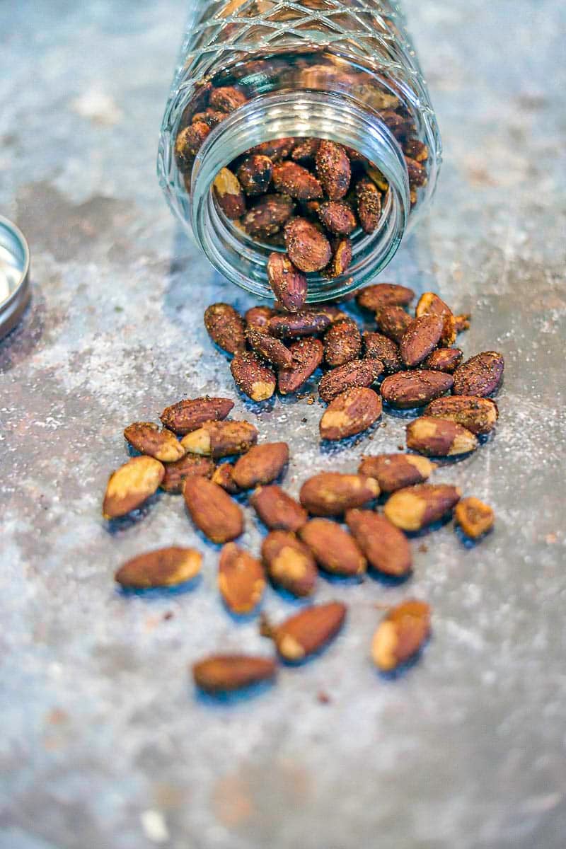 roasted almonds spilling out of a jar