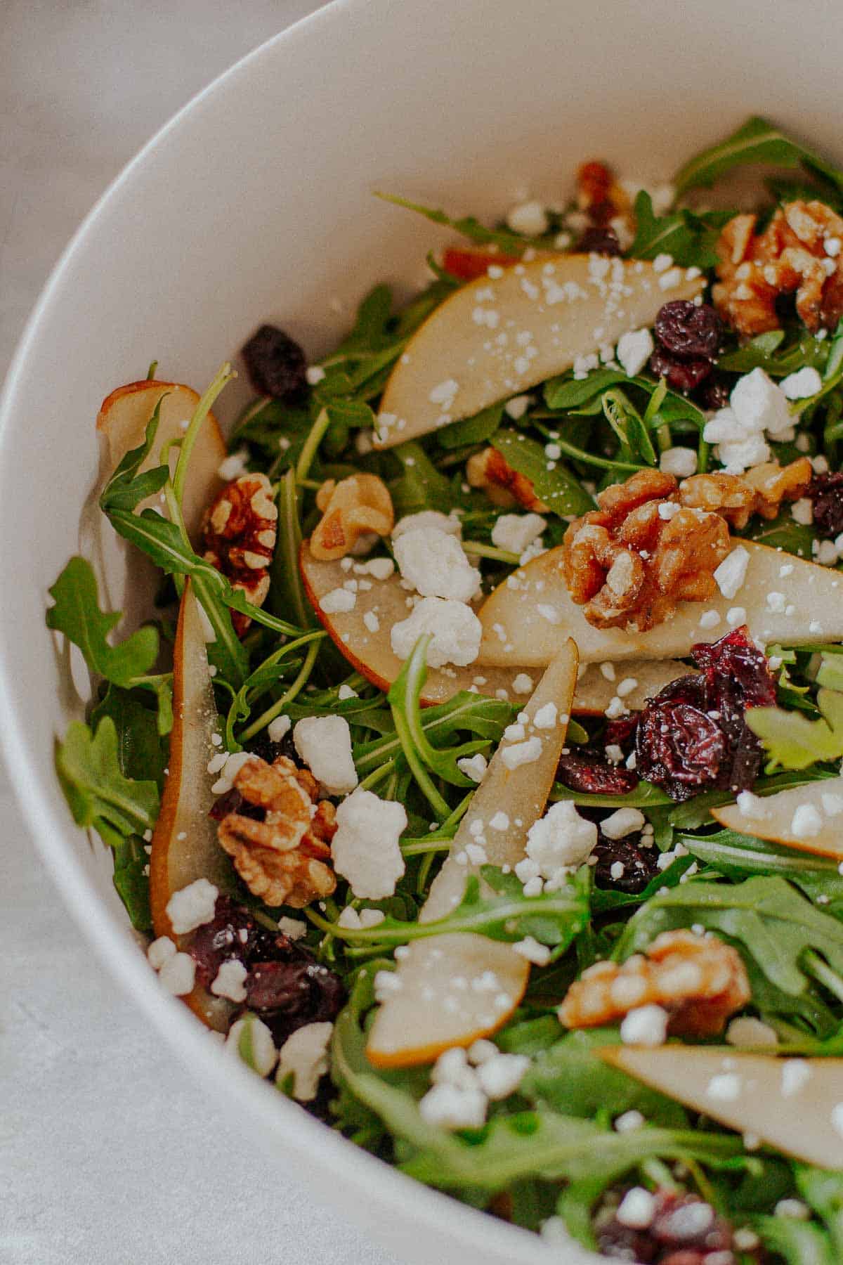 closeup of pear goat cheese salad in a bowl
