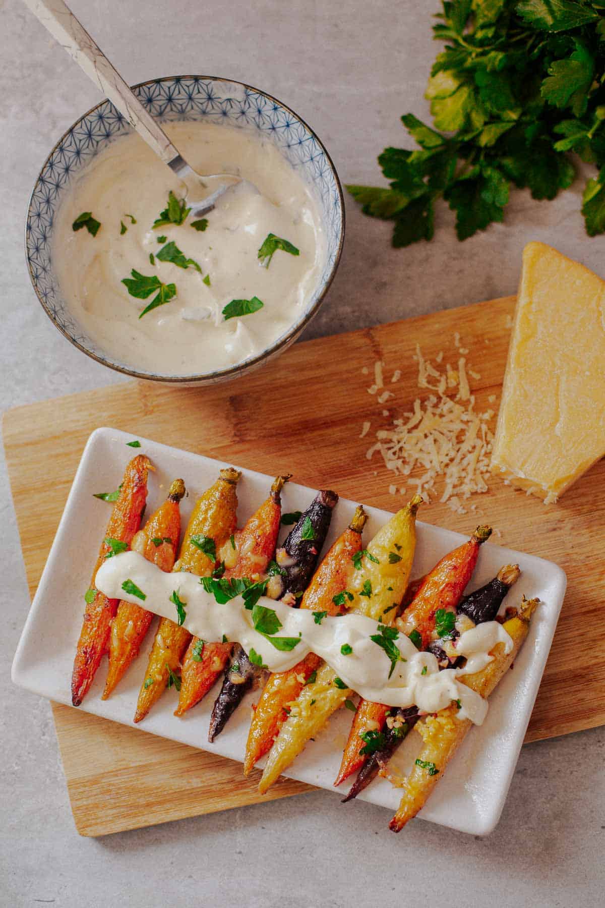 roasted multicolored carrots with aioli on top