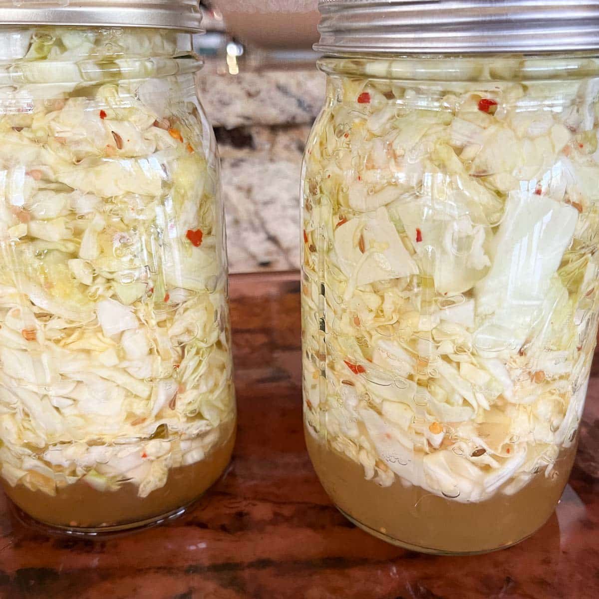 cabbage floating to the top of the jar